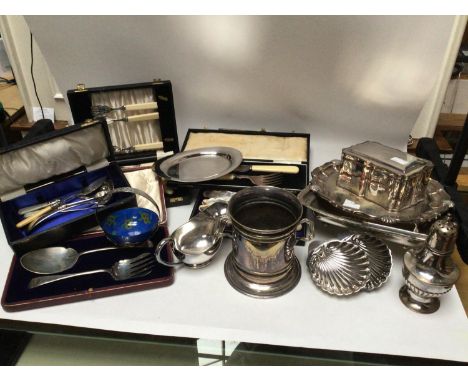 A large quantity of silver-plate including trays, casket, bread basket, jug, teapot and cased flatware etc. 