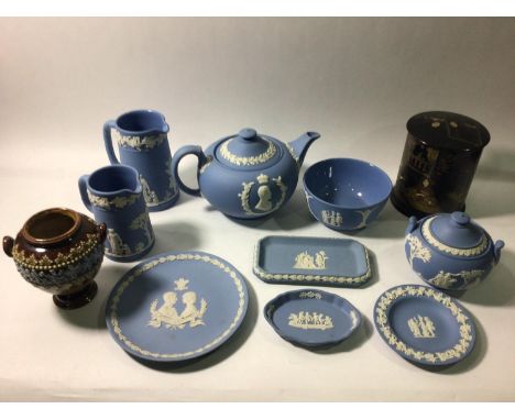 A Wedgwood Jasperware coronation teapot, 1953, together with two milk jugs, sugar bowl and pin dishes etc. Black laquer and g