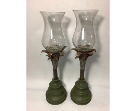 A pair of up-cycled candle holders with 19th century hand-blown glass 'Hurricane' oil lamp shades, metal tulip style supports