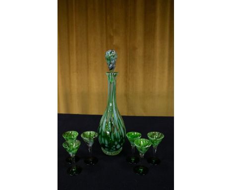 A seven-piece marbled green and opaque white glass liqueur set with gold 'aventurine' flake inclusions, comprising decanter w