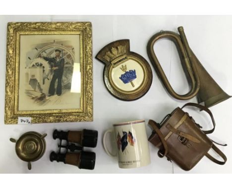A pair of early 20th century binoculars with brown leather cladding, together with an HMS Invincible ceramic crest, a Wedgwoo