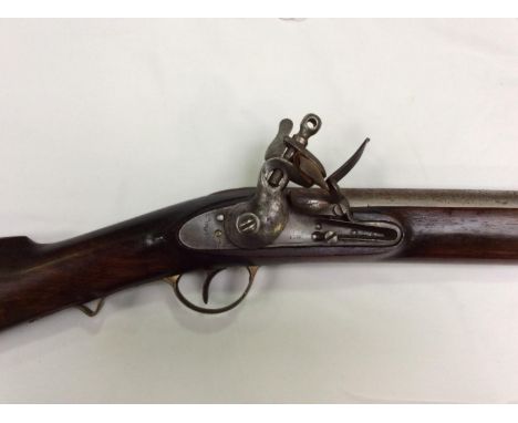 A late 18th/ early 19th century flintlock carbine, with 23" inch steel barrel, lock engraved with crowned GR and Tower mark, 