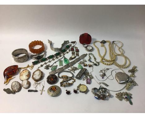 A quantity of costume jewellery and watches including silver rings, cameos, pearl necklaces, silver bracelets, amber coloured