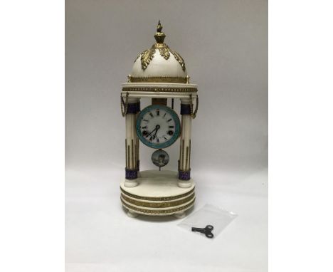 A large French white marble clock, eight day movement striking a bell, white enamel dial with black Roman numerals and painte