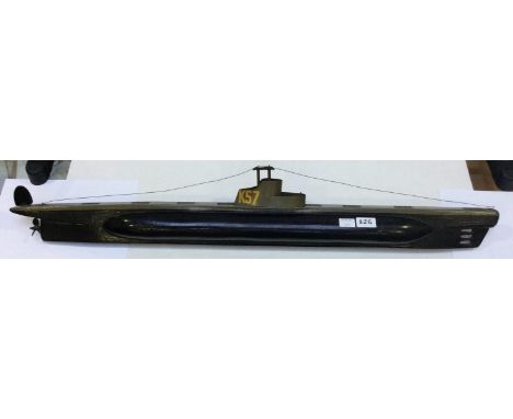 A scratch-built painted wooden composition model of submarine 'K57,' 100cm long, together with a reproduction brass field sig