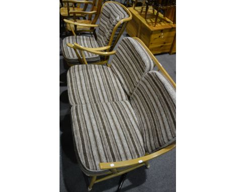 Ercol beech two seat settee, spindle-back, shaped arms, splayed legs joined by rails, loose cushions, width 129cm, height 76c