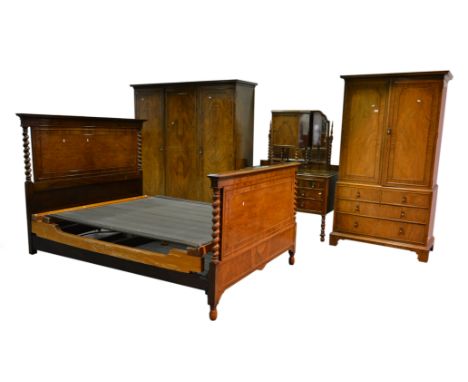 Burr walnut bedroom suite, comprising a triple wardrobe, cavetto moulded cornice, three doors with quartered veneers enclosin