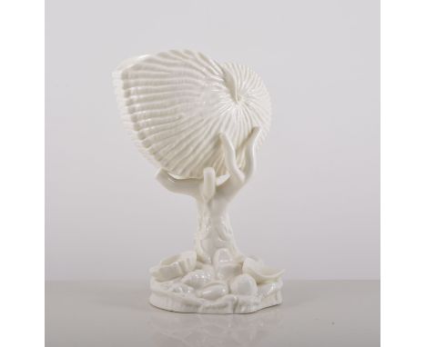 A Royal Worcester plain white Nautilus shell vase, 18cm.