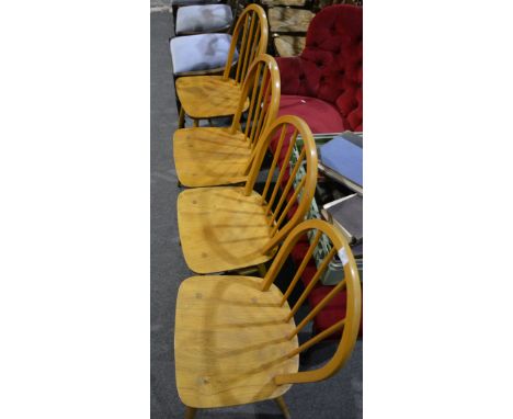 Four Ercol kitchen chairs, hoop and spindle-backs, boarded seats, splayed legs joined by rails, width 40cm, height 86cm.