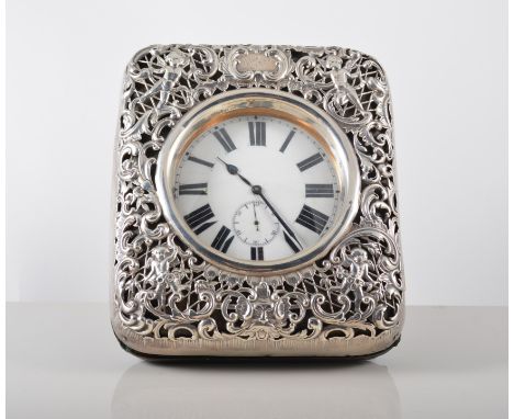 A Victorian silver faced and morocco pocket watch case, by William Comyns, London 1899, open scroll work decoration with cher