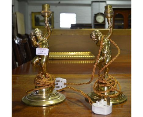 Pair of brass table lamps, cherub columns, circular bases, height to fitments 30cm, a Continental pottery mounted urn shape l