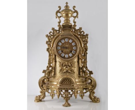 Reproduction French style cast brass clock garniture, clock with an urn finial and enamel numerals, 60cm with a pair of six l