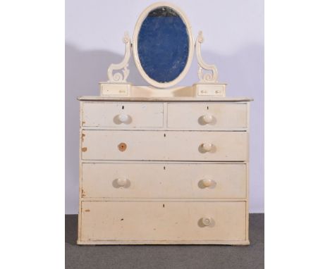 A Victorian painted pine dressing table, oval adjustable mirror with scrolled supports over trinket drawers, top with a mould