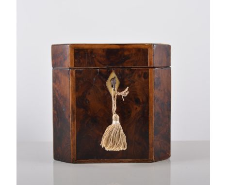 A Georgian yew wood tea caddy, with banding and stringing, canted corners, width 12cm.