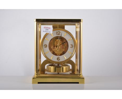 A Jaeger Lecoultre Atmos clock, lacquered brass case, 23cms, complete with wall bracket.