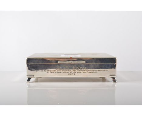 An electroplated cocktail shaker, shouldered form, engine turned band, 24cm and a presentation electroplated cigarette box (2
