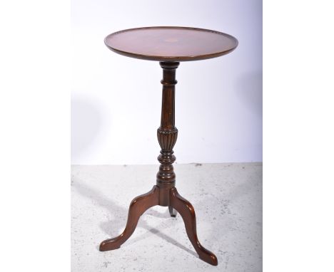 Mahogany tripod table, circular top with a moulded edge, satinwood fan inlay and boxwood stringing, turned and fluted column,