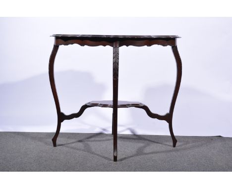 Edwardian mahogany window table, shaped oval top with moulded edge, carved and scrolled legs, joined by a shelf, width 84cm, 