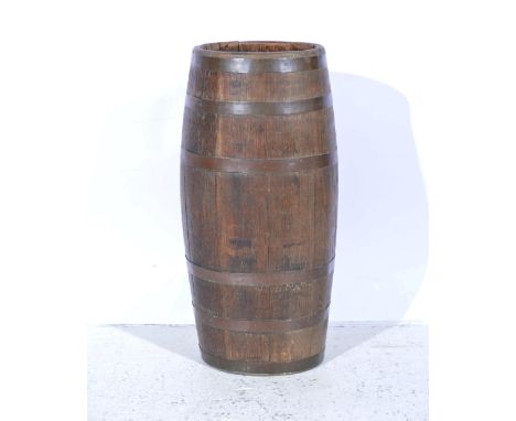 Coopered oak barrel shape stick stand, overall width approximately 32cm, height 66cm.