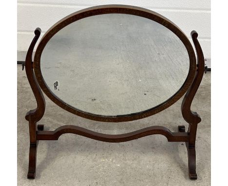 An Edwardian oval dressing table swing mirror with shaped legs and supports. Approx. 48.5 x 51.5cm. 