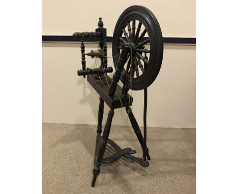 LATE VICTORIAN OAK SPINNING WHEEL the treadle shaped in the form of a harp, 95cm high, 78cm wide