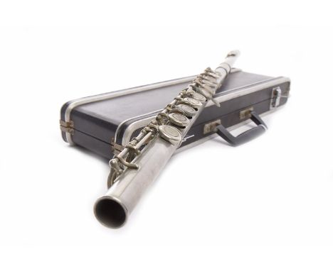 WOODEN CLARINET BY BOOSEY & HAWKES LTD.No. 33796, with two mouth pieces, in a fitted case also a metal flute, in case (2)