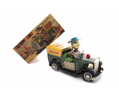 TINPLATE BATTERY OPERATED SHERIFF CAR  possibly by Nomura, circa 1960s, green Sheriff's car with Sheriff modelled as driver, 