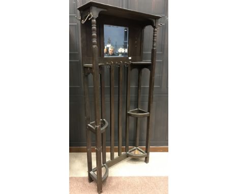EDWARDIAN OAK HALL STANDwith inset bevelled mirror, two internal stick stands within square uprights, 89cm wide, 186cm high
