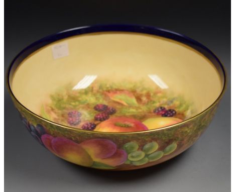 A Royal Worcester bowl, the fruit painted by the artist F Clark