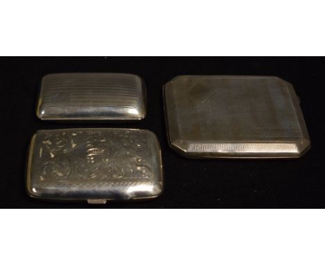 A silver cigarette case, engine turned decoration, Birmingham 1924; others smaller (3)