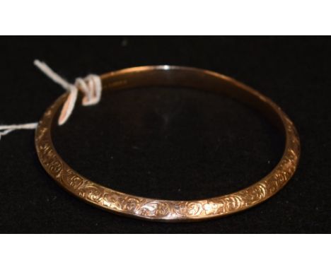 A 9ct rose gold bangle, chased foliate decoration, 1899, Birmingham, Lawson Ward and Gammage 