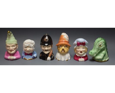 Six Royal Worcester limited edition candle snuffers; Policeman Punch; Judy; Crocodile; Baby Toby, all boxed with certificate 