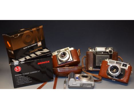 Photographic equipment - a Zeiss Ikon camera in leather case; another Zeiss Ikon; a Yashica camera in leather case; an Canon 