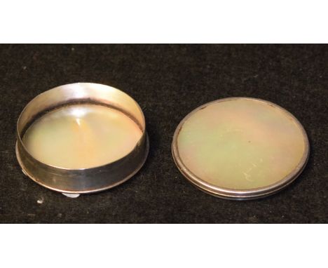 A 19th century silver coloured metal and mother of pearl circular snuff box, push-fitting cover, quite plain, 4cm diam