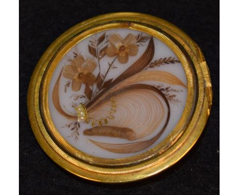 A George III hair work and seed pearl locket converted brooch, painted opaline milk glass panel inset and adorned with hair w