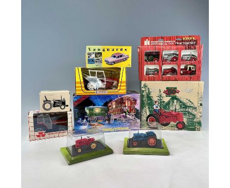 Boxed Tractors, etc.A box containing 7 boxed tractors by ERF, Lone Star, etc.Lot also includes a Matchbox Model of Yesteryear