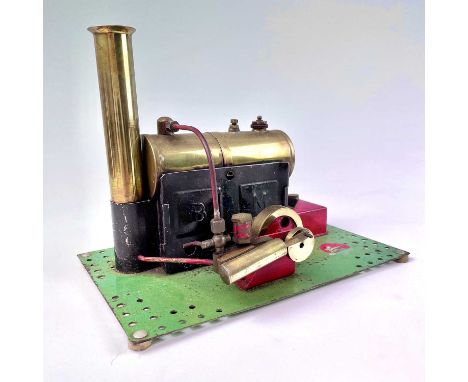 Bowman Stationary Engine.A Bowman brass stationary engine on green metal base. (24cm x 15cm).