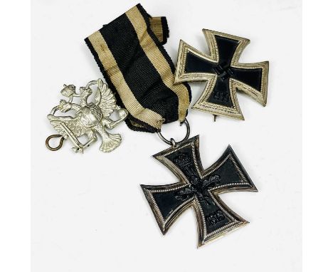 Germany - Iron Crosses (x2).Lot comprises First World War Iron Cross complete with ribbon, a World War II pin fixing Iron Cro