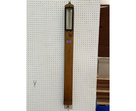 An early 20th century oak mercurial stick barometer by J.Davies and Son, Derby. 37' high