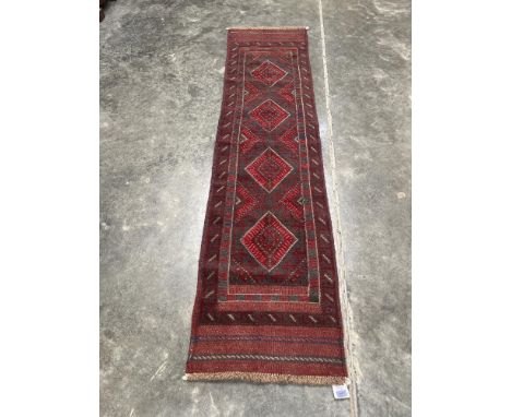 A Meshwani carpet runner. 2.4m x 0.6m