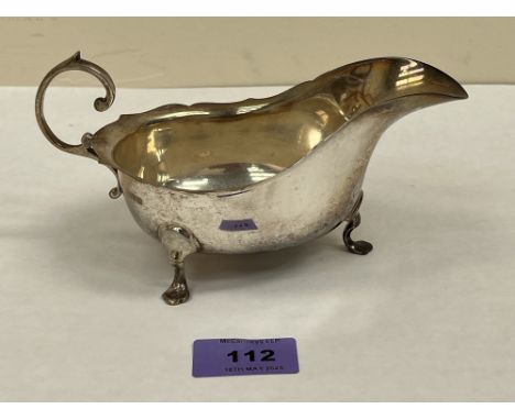 A George V silver sauce boat of helmet form. Chester 1919. 7½' long over handle. 5ozs 13dwts