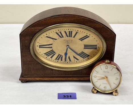 An early 20th century mantle clock and a Looping alarm clock