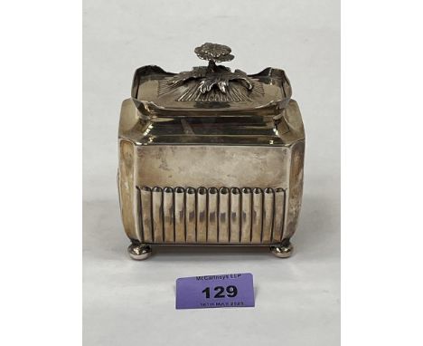 A Victorian silver half-gadrooned tea caddy with foliate finial on bun feet. Sheffield 1889. 3½' wide. 7ozs