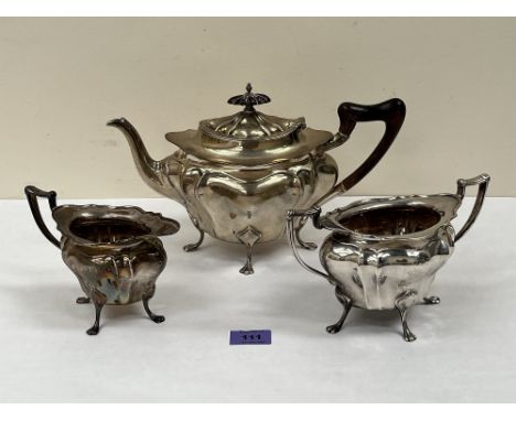 A George V silver three piece tea service by Walker and Hall, to comprise teapot, sucrier and milk jug. Sheffield 1912. 42ozs