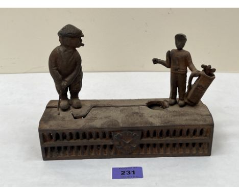 A cast iron golfer and caddy money bank. 8½' wide