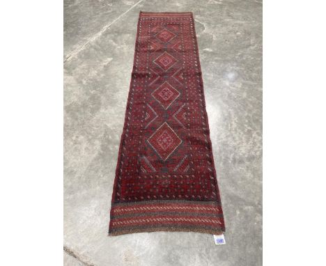 A Meshwani carpet runner. 2.54m x 0.64m