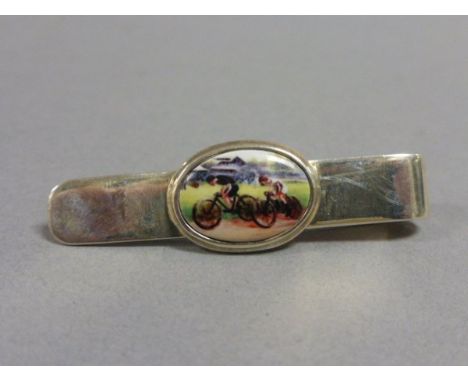 Silver tie/money clip with enamel panel depicting cyclists