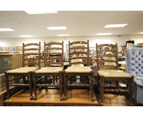 Set of four rustic oak ladder back dining chairs with string seats  
