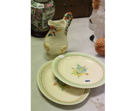 Three items of Clarice Cliff including jug and two plates