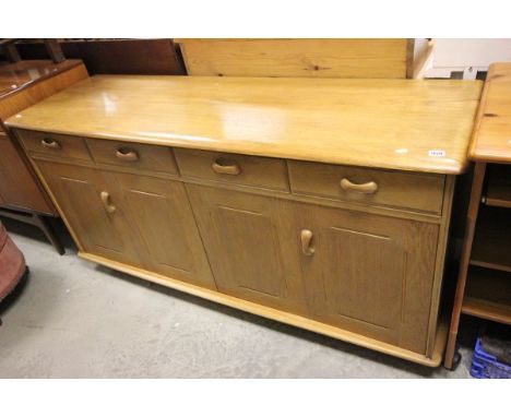 Ercol style pale oak & elm sideboard with four drawers over two cupboards (each with two concertina doors)